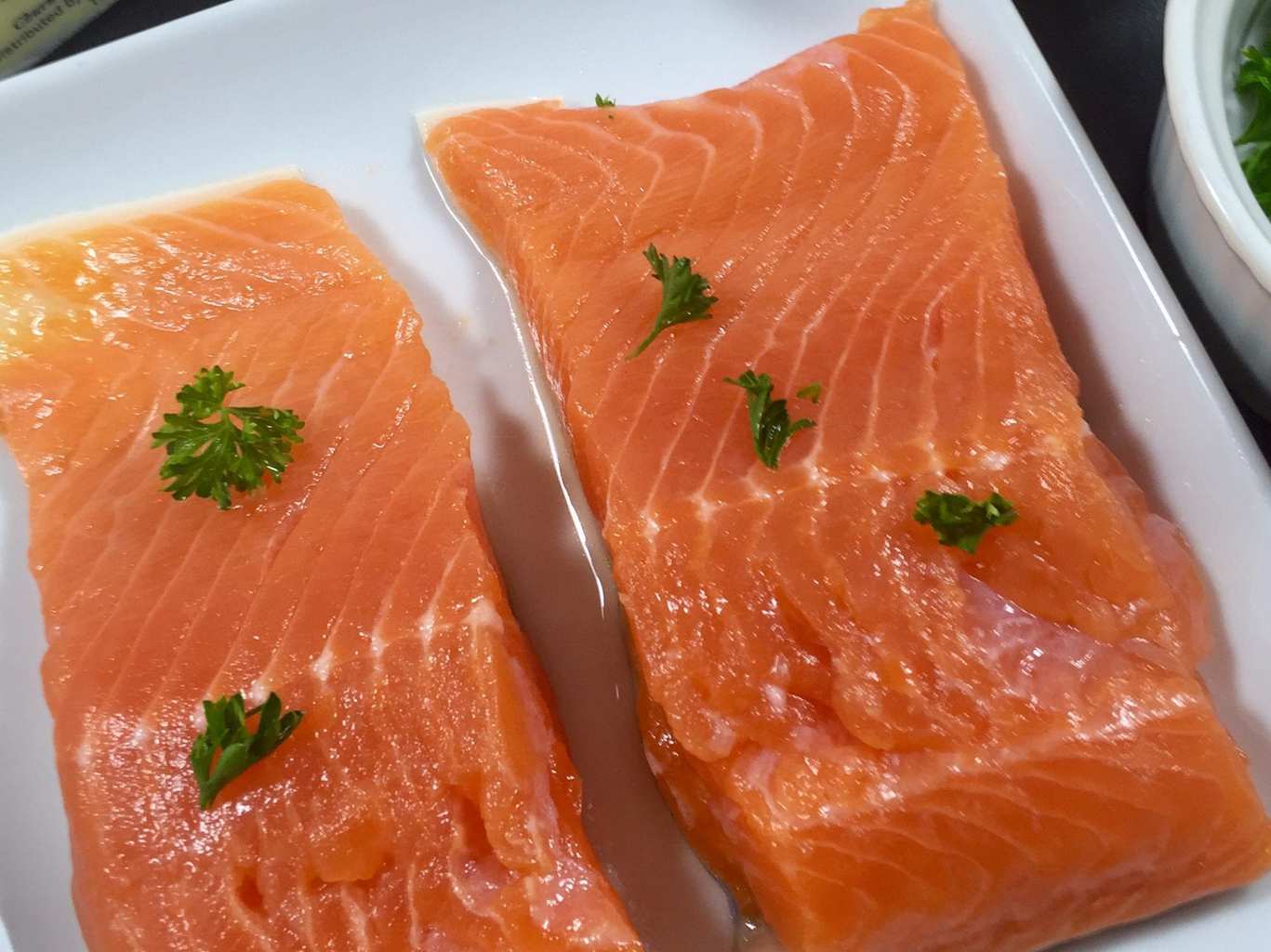 Fresh salmon on a white plate