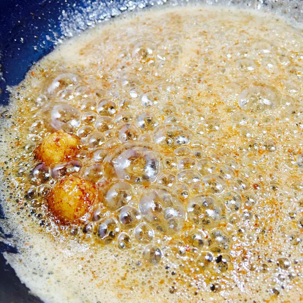 Browned butter and garlic sizzling in a pan