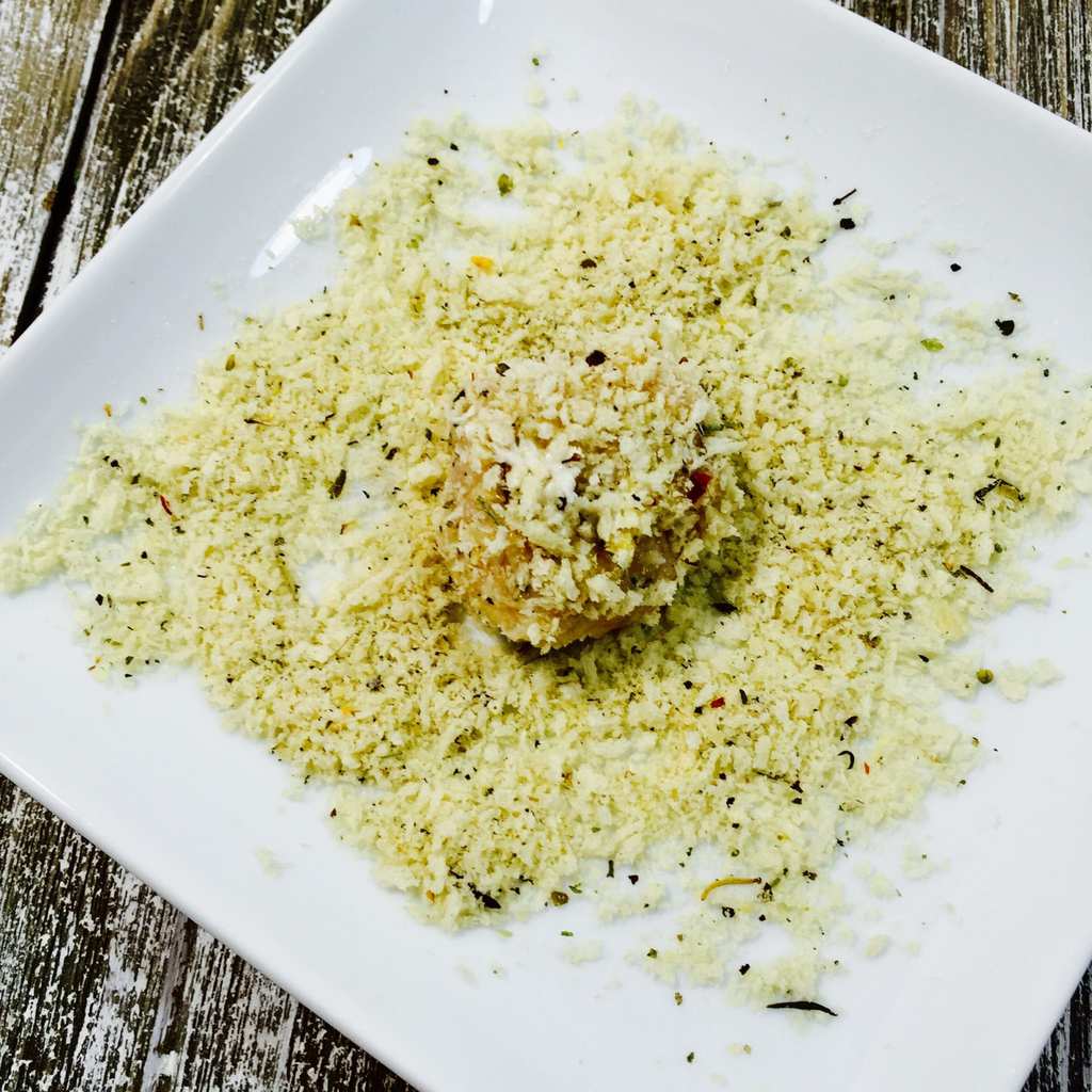 Chicken meatball rolled in Panko on a white plate