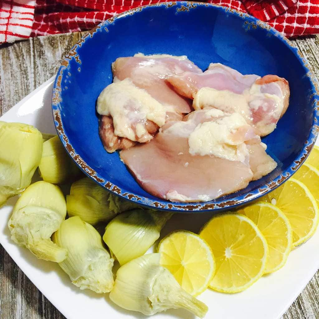 Chicken thighs, lemons and artichokes