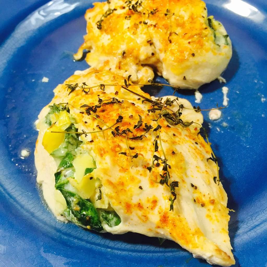 Baked Stuffed chicken on a blue plate