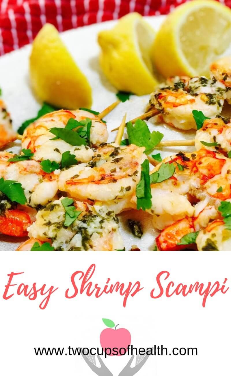 Shrimp Scampi on skewers on a white plate